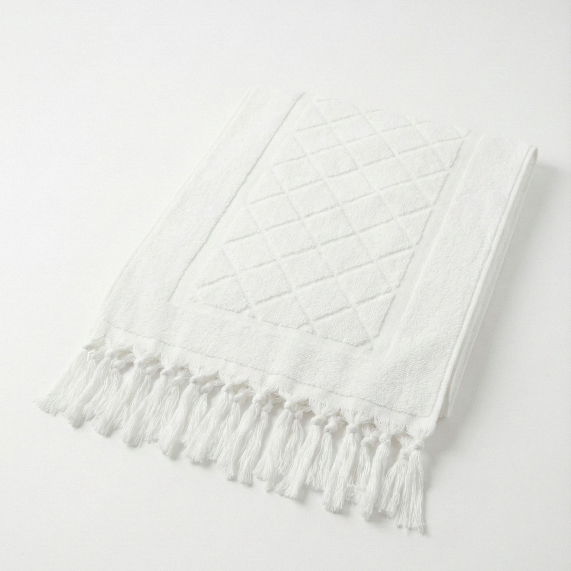 Hand-woven Baklava Design Turkish hand towel with traditional diamond pattern a light gray background