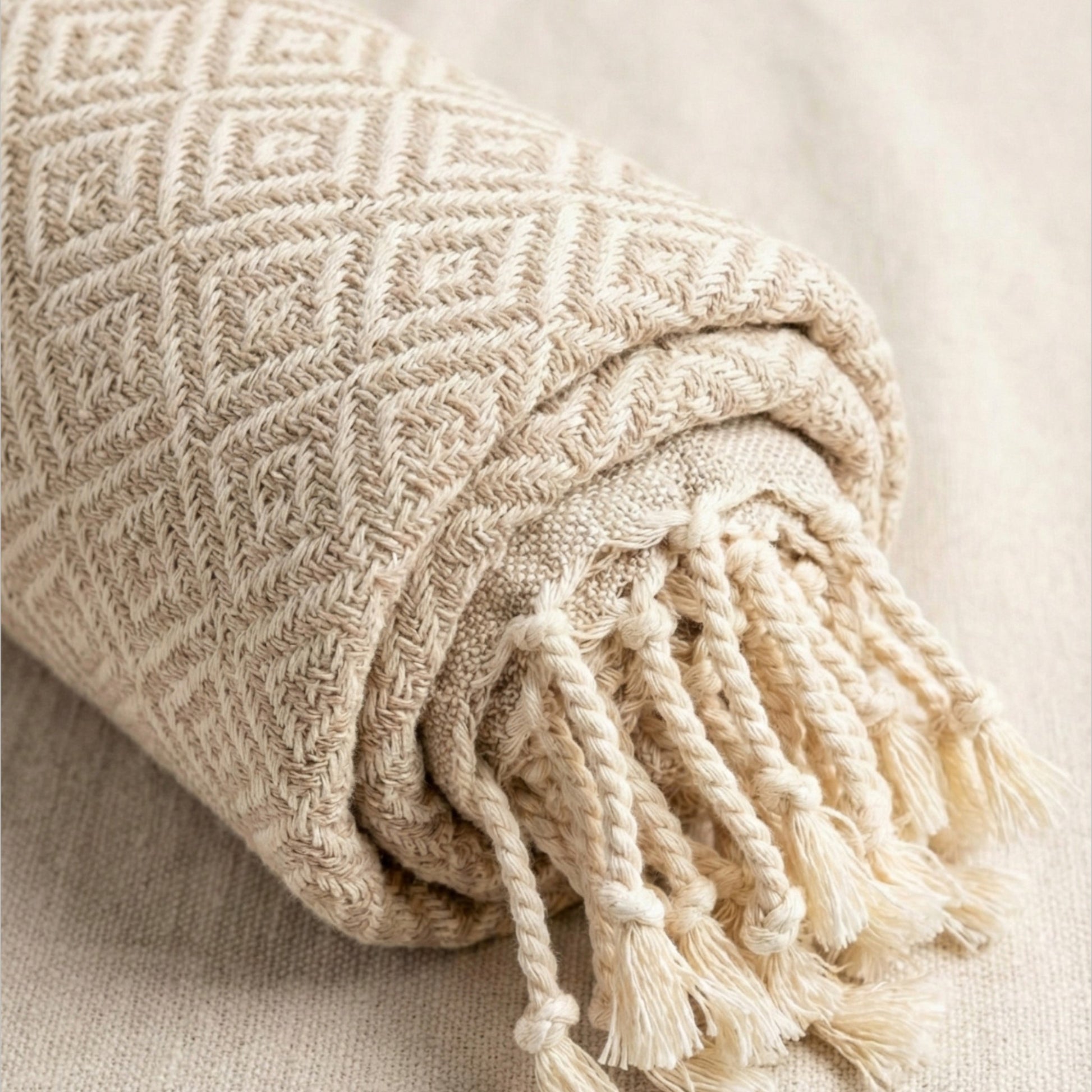 Beige woven Diamond Design Turkish Hand Towel  Handwoven Natural Cotton Sustainable Anatolian Craft with tassels on a neutral background
