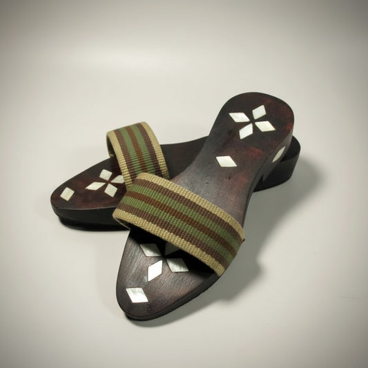 Pair of wooden sandals with striped straps on a light gray background - Handcrafted Mother of Pearl Inlaid Hammam Clogs 