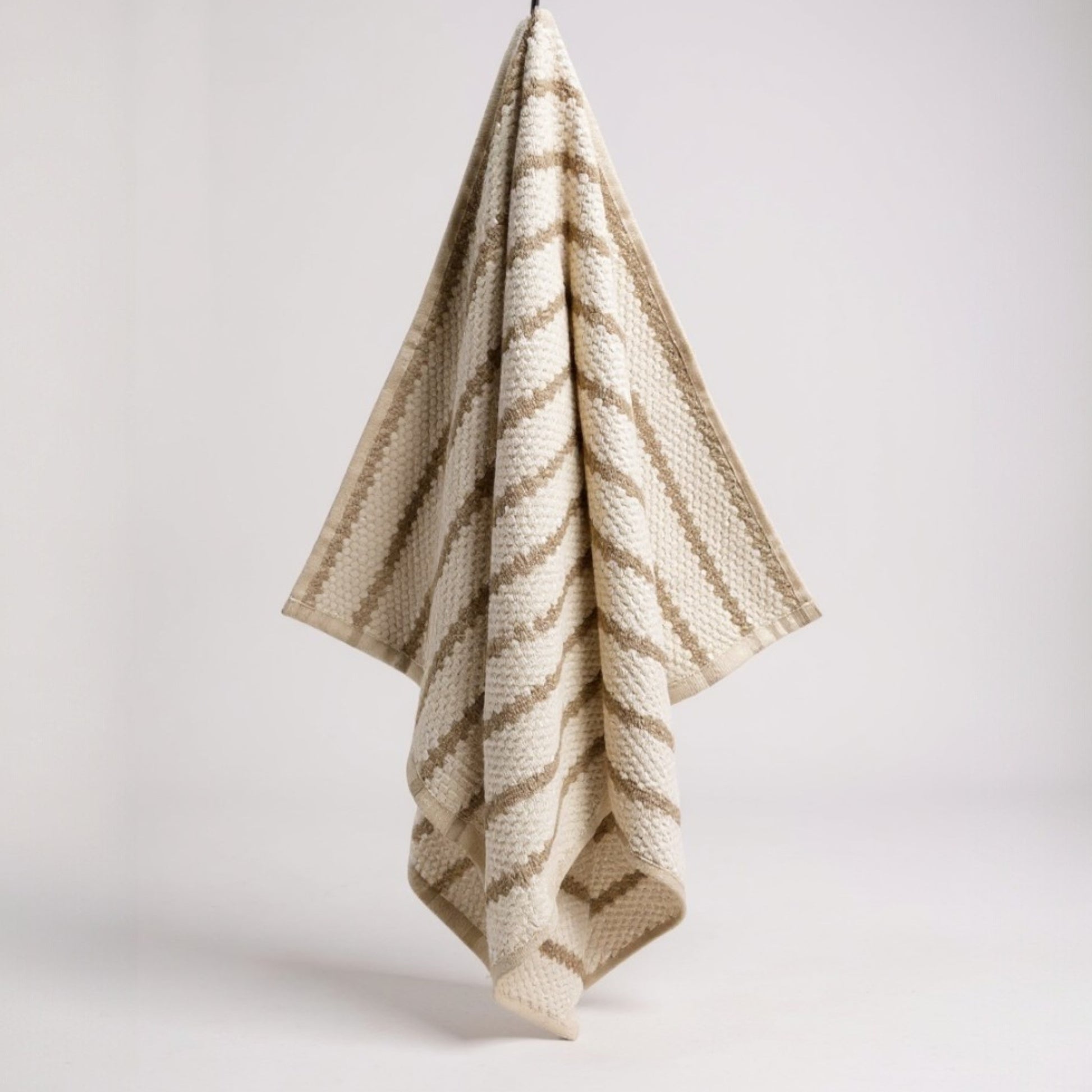 Handmade handwoven natural cotton Turkish hand towels in striped design, shown in four color variations, versatile for hand, head, guest, or kitchen use.