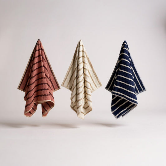 Handmade handwoven natural cotton Turkish hand towels in striped design, shown in four color variations, versatile for hand, head, guest, or kitchen use.
