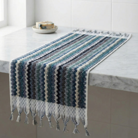 Handwoven Natural Turkish Cotton Terry Hand Towel Zigzag Pattern with tassels on a marble surface