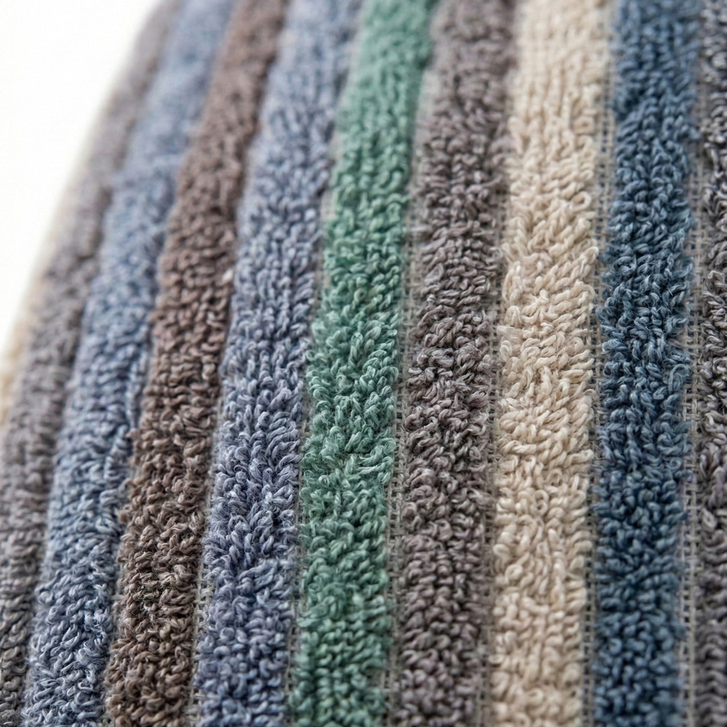 Close-up of textured Handwoven Turkish Terry Towel Men’s Bathrobe in various colors.