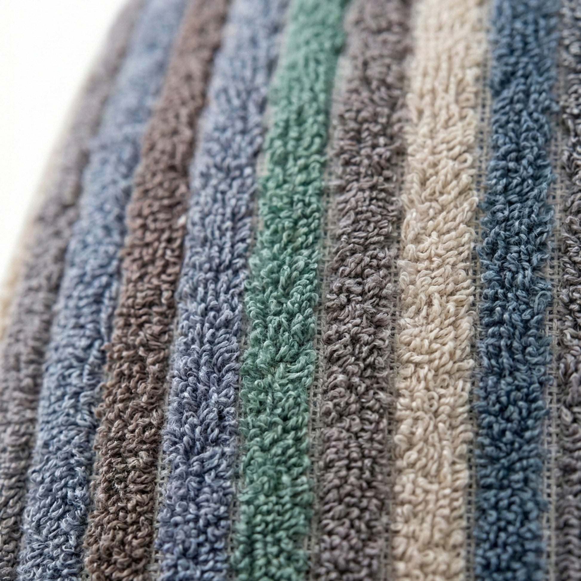 Close-up of textured Handwoven Turkish Terry Towel Men’s Bathrobe in various colors.