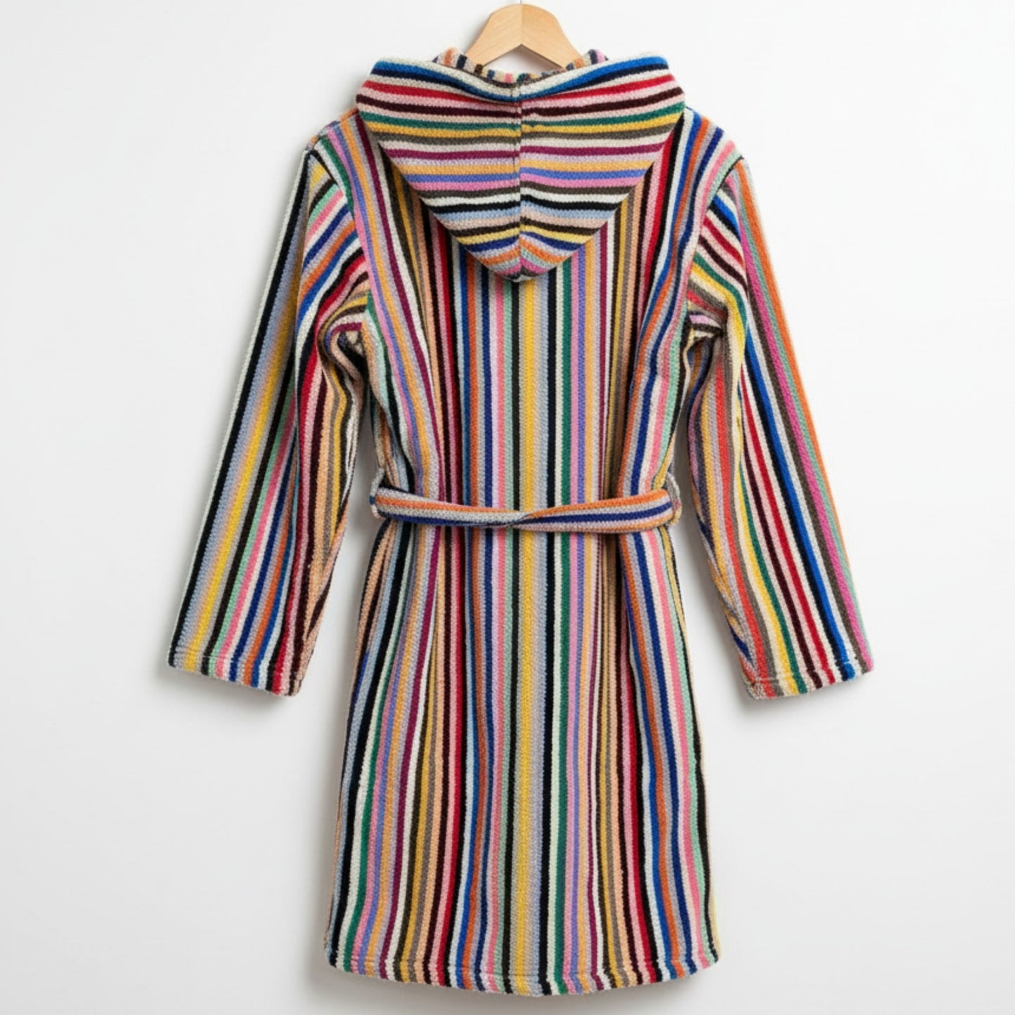 Multicolored striped robe on a hanger against a white background