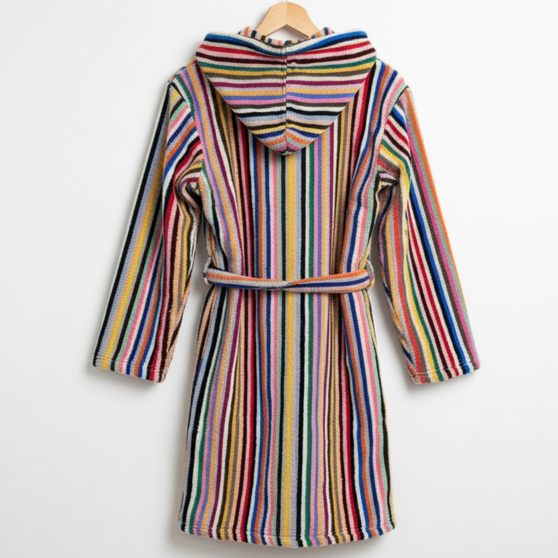 Multicolored striped robe on a hanger against a white background