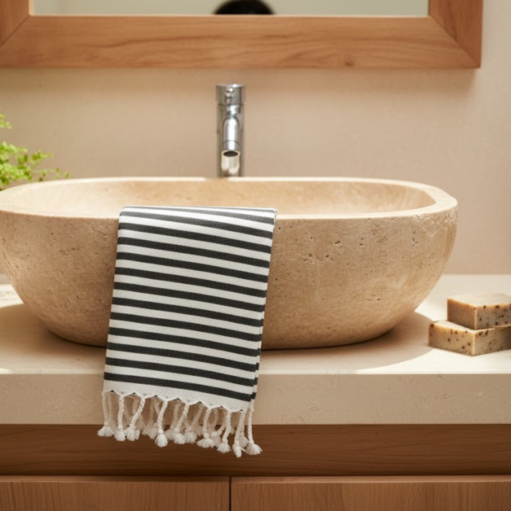 Striped Natural Cotton Traditional Hand Towel draped over a stone sink in a bathroom setting