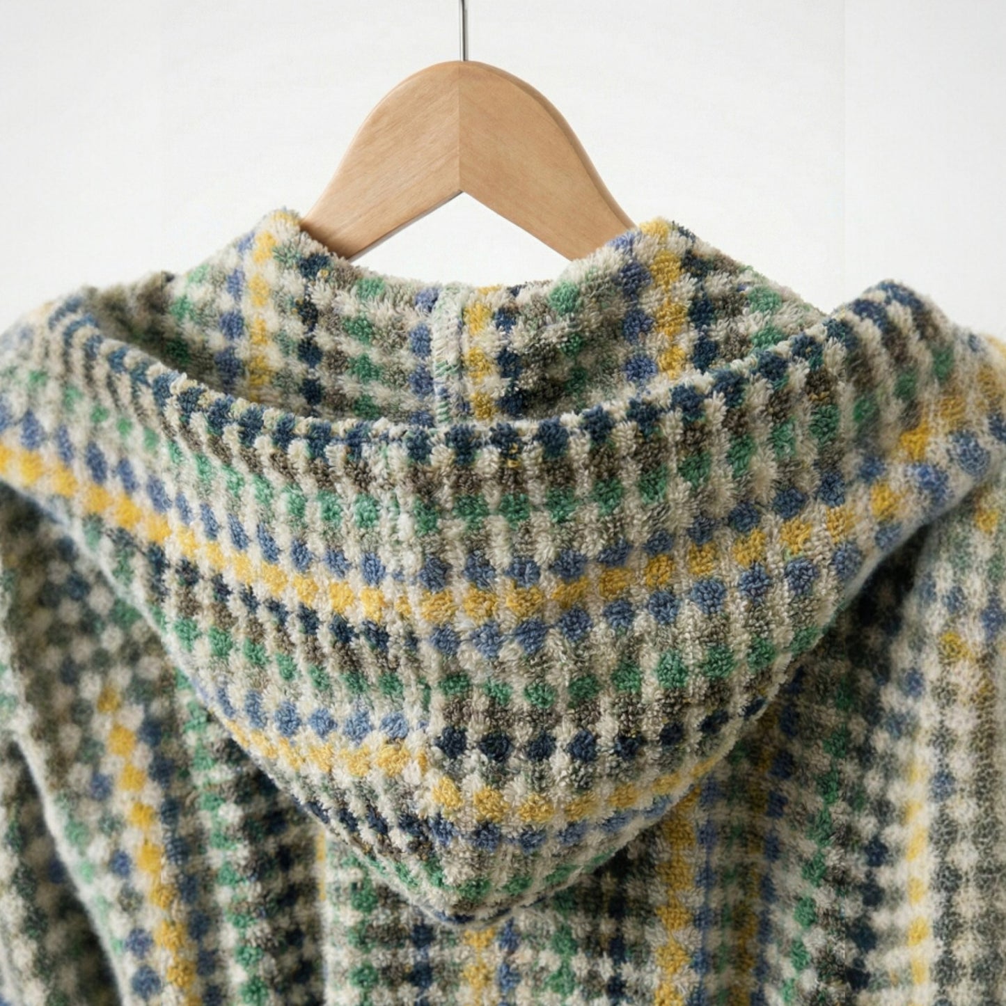 Turkish Terry Bathrobe Hooded, Unisex, Premium Cotton over a wooden hanger against a white background