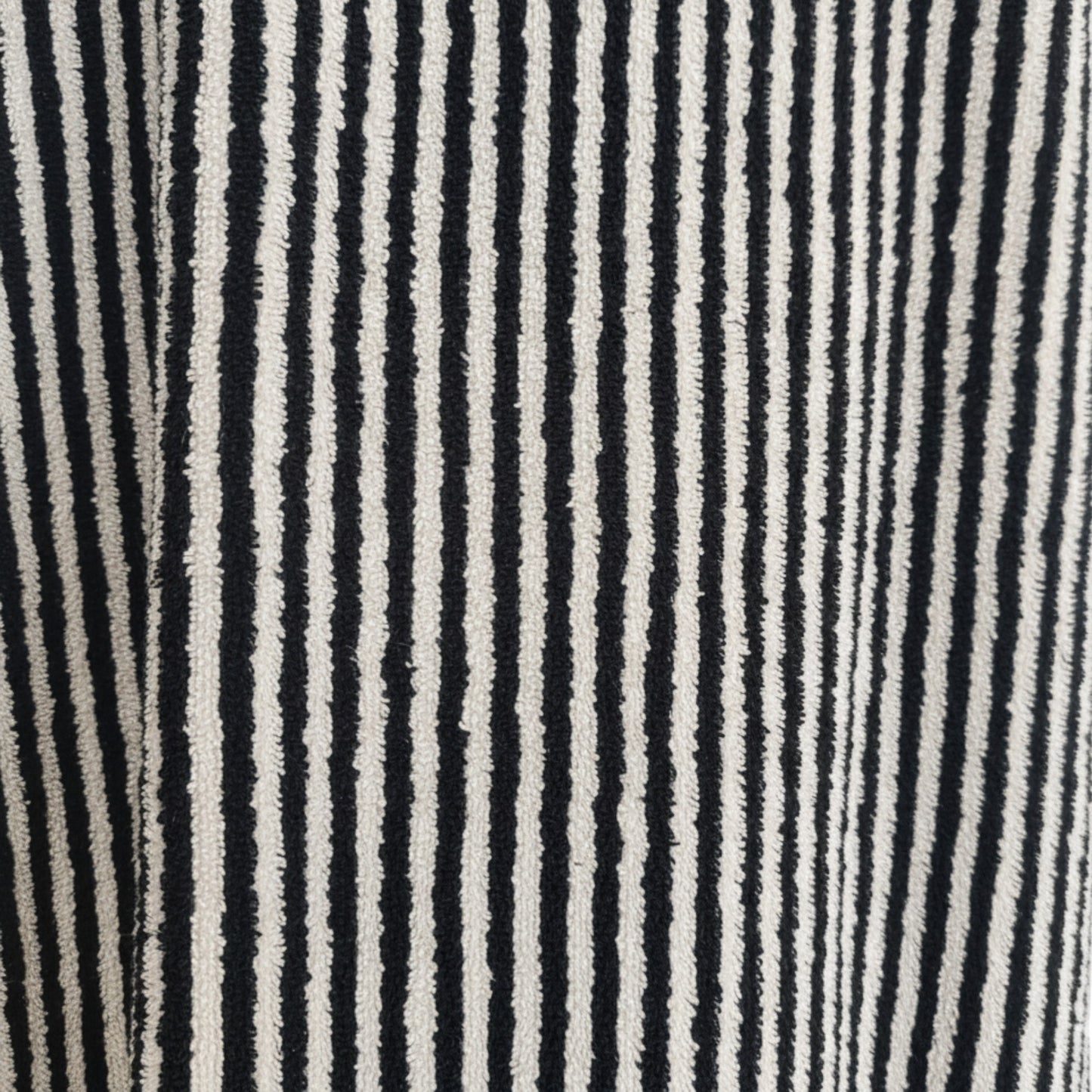 Turkish terry towel unisex bathrobe in black and white stripe design with a shawl collar, made from natural cotton for comfort and absorbency.