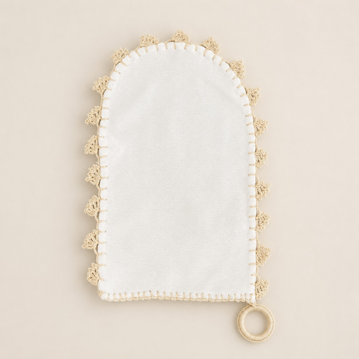 Full view of Derviş handwoven ivory crêpe silk Turkish hammam kese with handmade needle-lace edging and hanging loop.